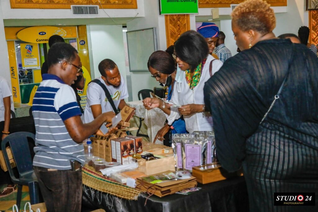 Benjamin Setor sharing samples of chocolate to people at the cocoa products exhibition during.