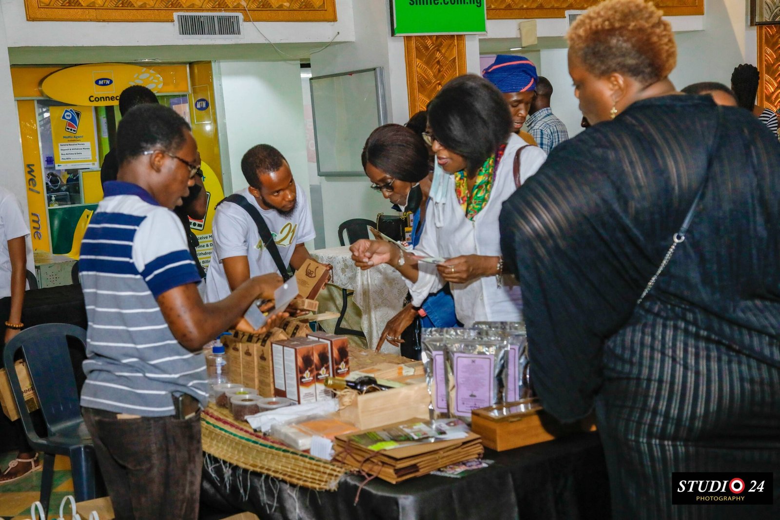 Benjamin Setor sharing samples at the cocoa products exhibition.